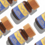 Utopia Clarity 75mg microdose capsules bottles in a flat lay pattern on white background.