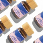 Utopia Tranquil 50mg microdose capsules laid flat in repeating pattern.